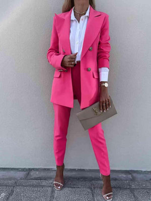 a woman wearing a pink suit and heels