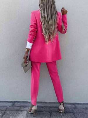 a woman in a pink suit and heels