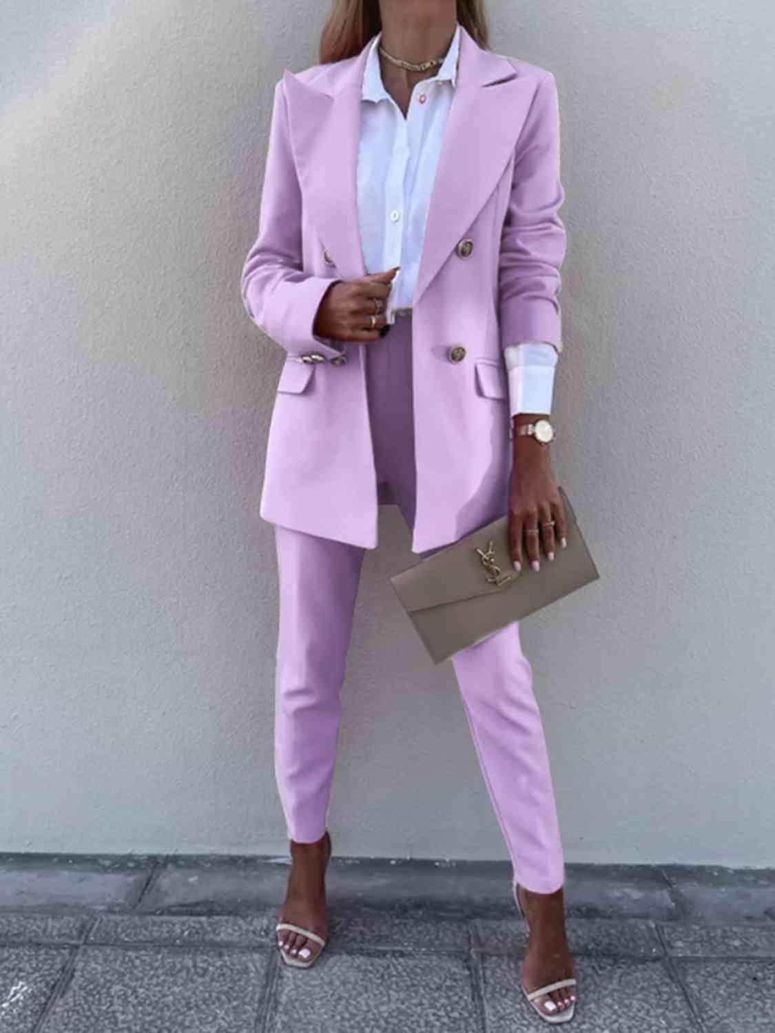 a woman wearing a pink suit and heels