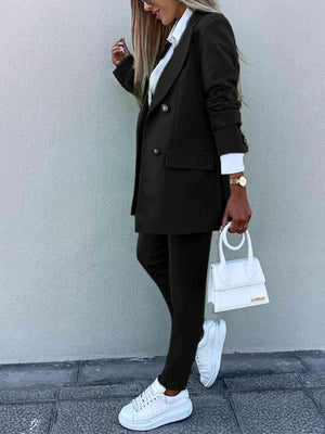 a woman in a black suit and white shoes