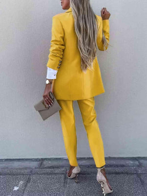 a woman wearing a yellow suit and heels