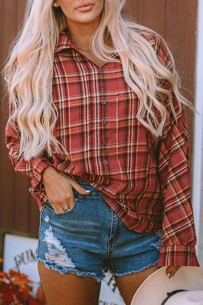 a woman wearing a plaid shirt and denim shorts