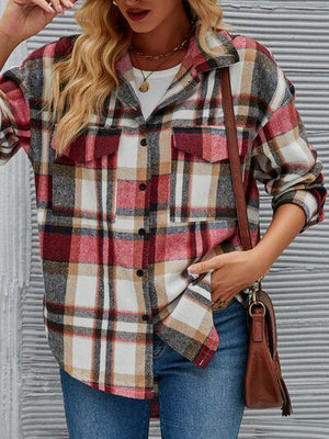 a woman wearing a plaid shirt and jeans