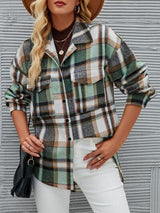 a woman wearing a hat and a plaid shirt