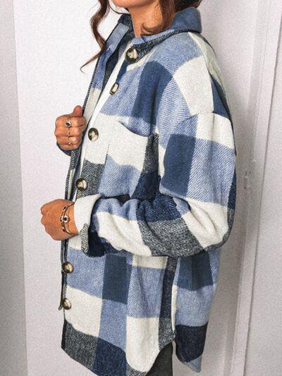 a woman wearing a blue and white checkered coat