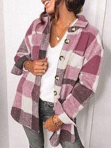 a woman wearing a pink and white checkered coat