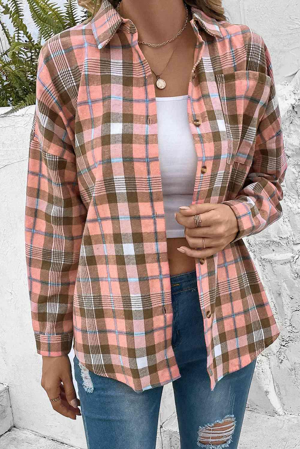 a woman wearing a plaid shirt and ripped jeans