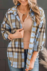 a woman wearing a plaid shirt and jeans