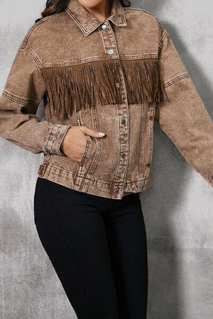 a woman wearing a jacket with fringes on it
