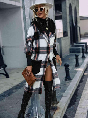 a woman standing on a street corner wearing a plaid coat and thigh high boots