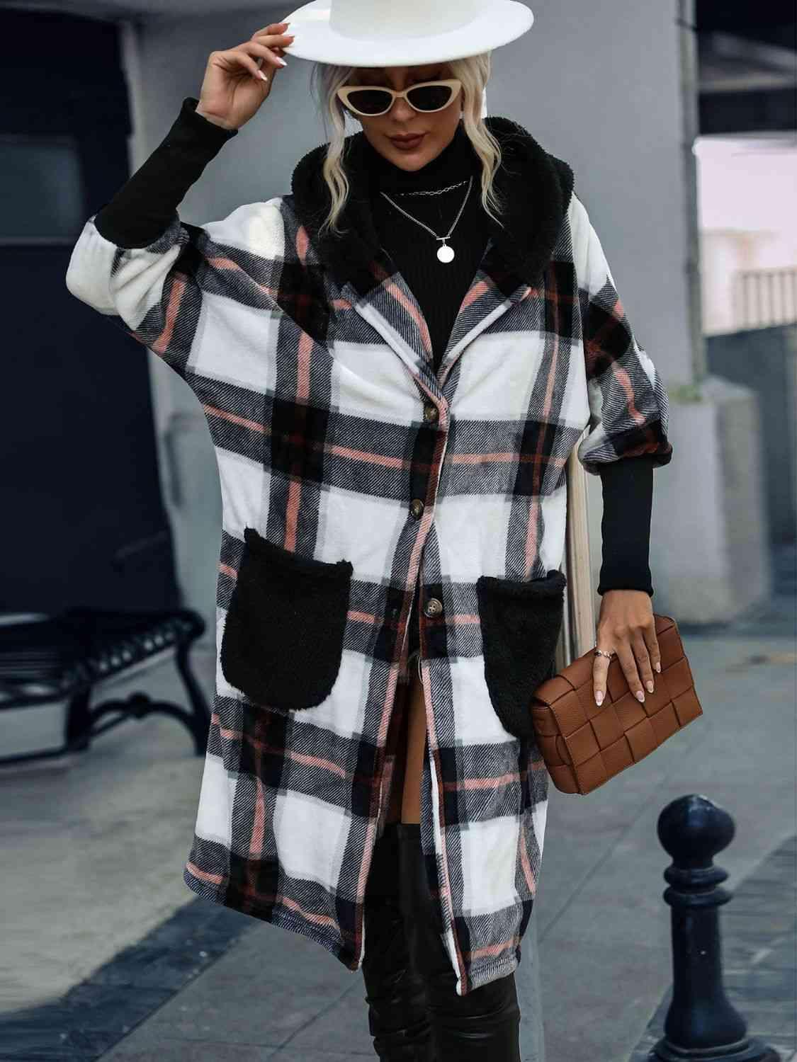 a woman wearing a white hat and plaid coat
