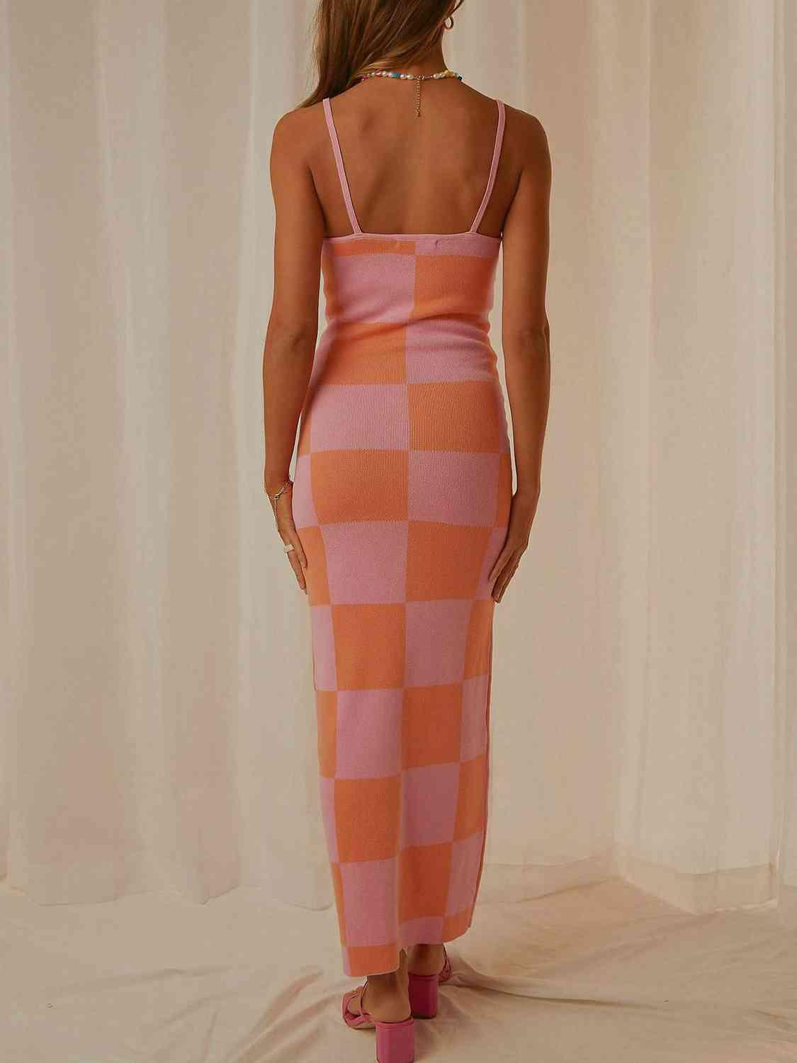 a woman in a pink and orange checkered dress