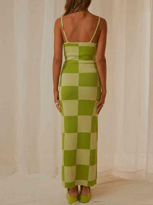 a woman in a green and white checkered dress