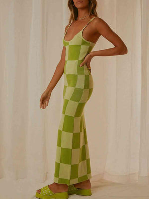 a woman in a green and white checkered dress