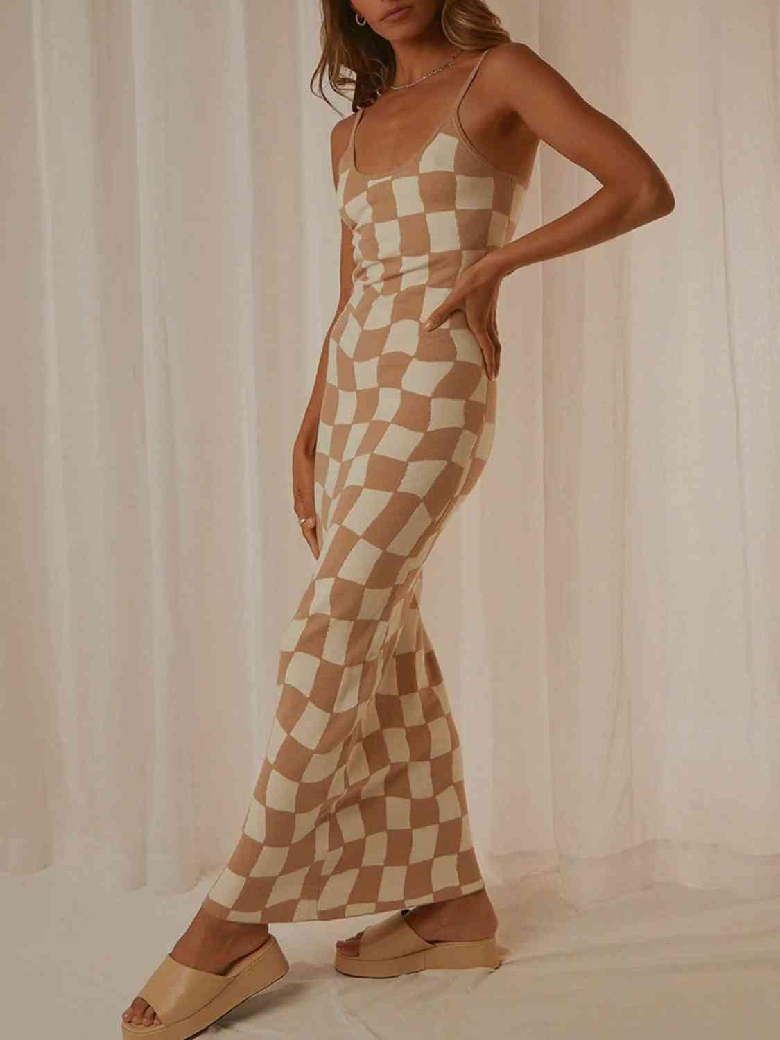 a woman in a brown and white checkered dress