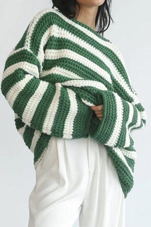 a woman wearing a green and white striped sweater