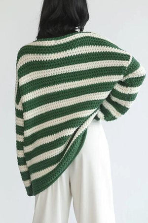 a woman wearing a green and white striped sweater