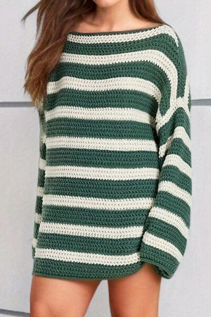 a woman wearing a green and white striped sweater