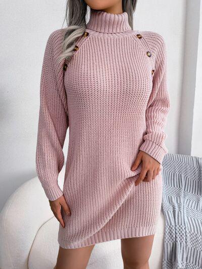 a woman wearing a pink sweater dress