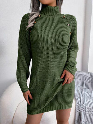 a woman wearing a green sweater dress