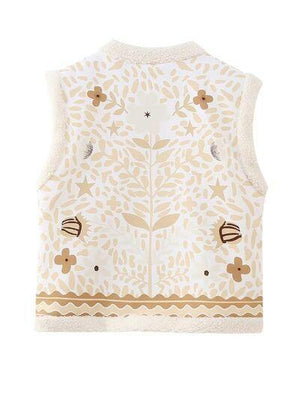 a white vest with a flower pattern on it