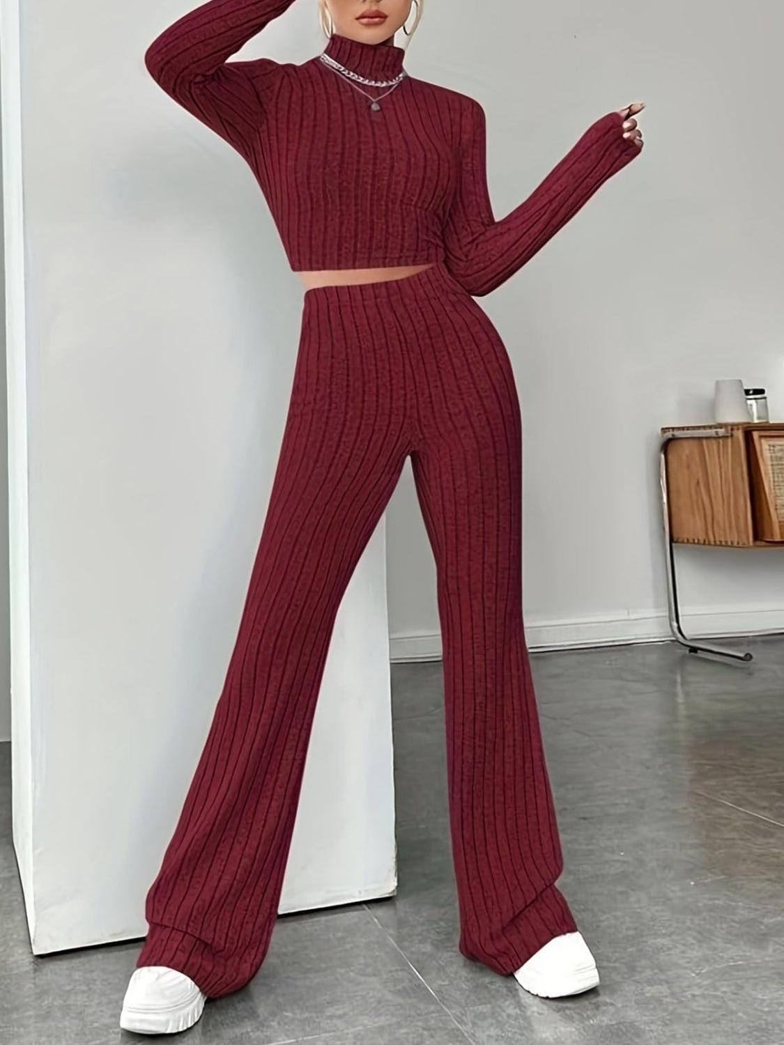 a woman in a red sweater and pants