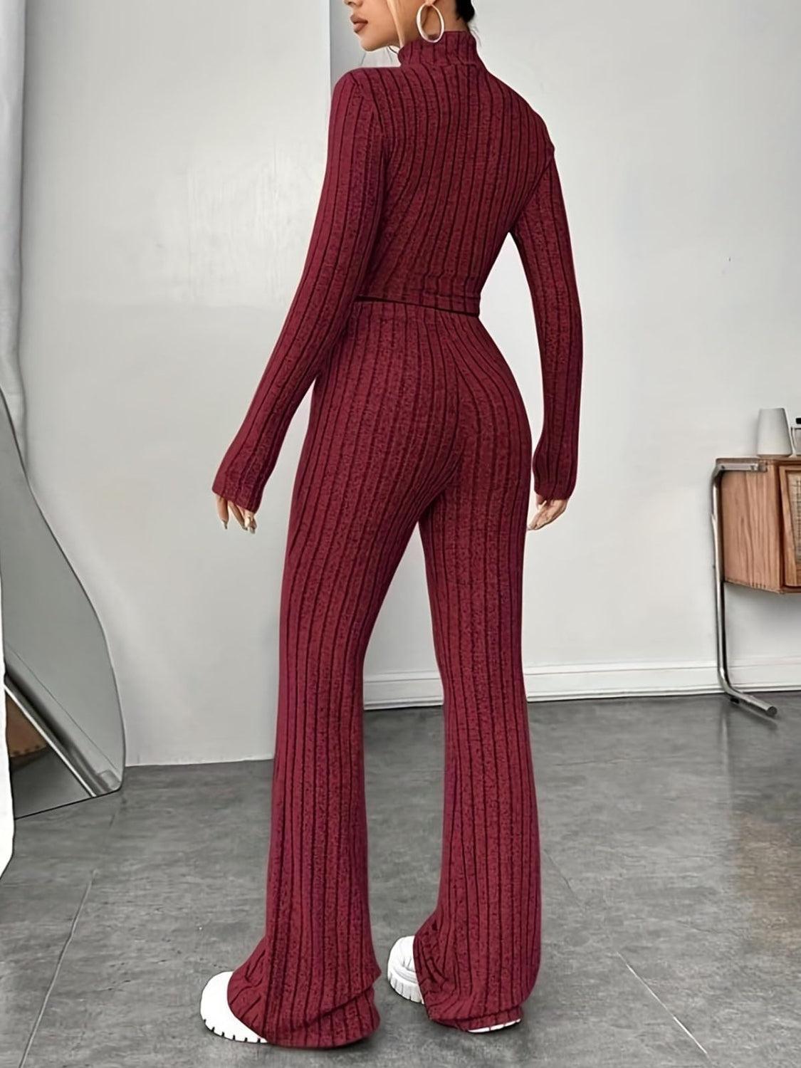 a woman in a red sweater and pants