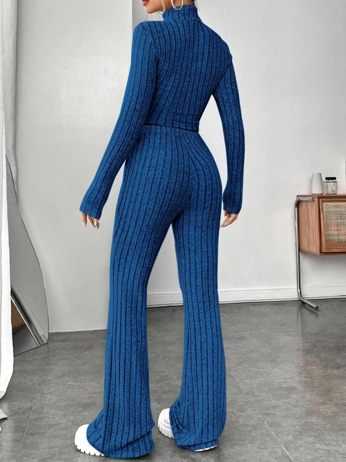 a woman wearing a blue knitted jumpsuit