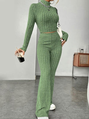 a woman in a green sweater and matching pants