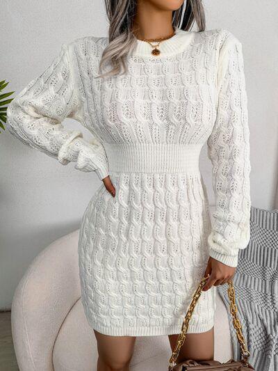 a woman wearing a white sweater dress