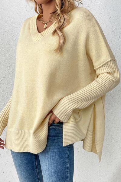 a woman wearing a yellow sweater and jeans