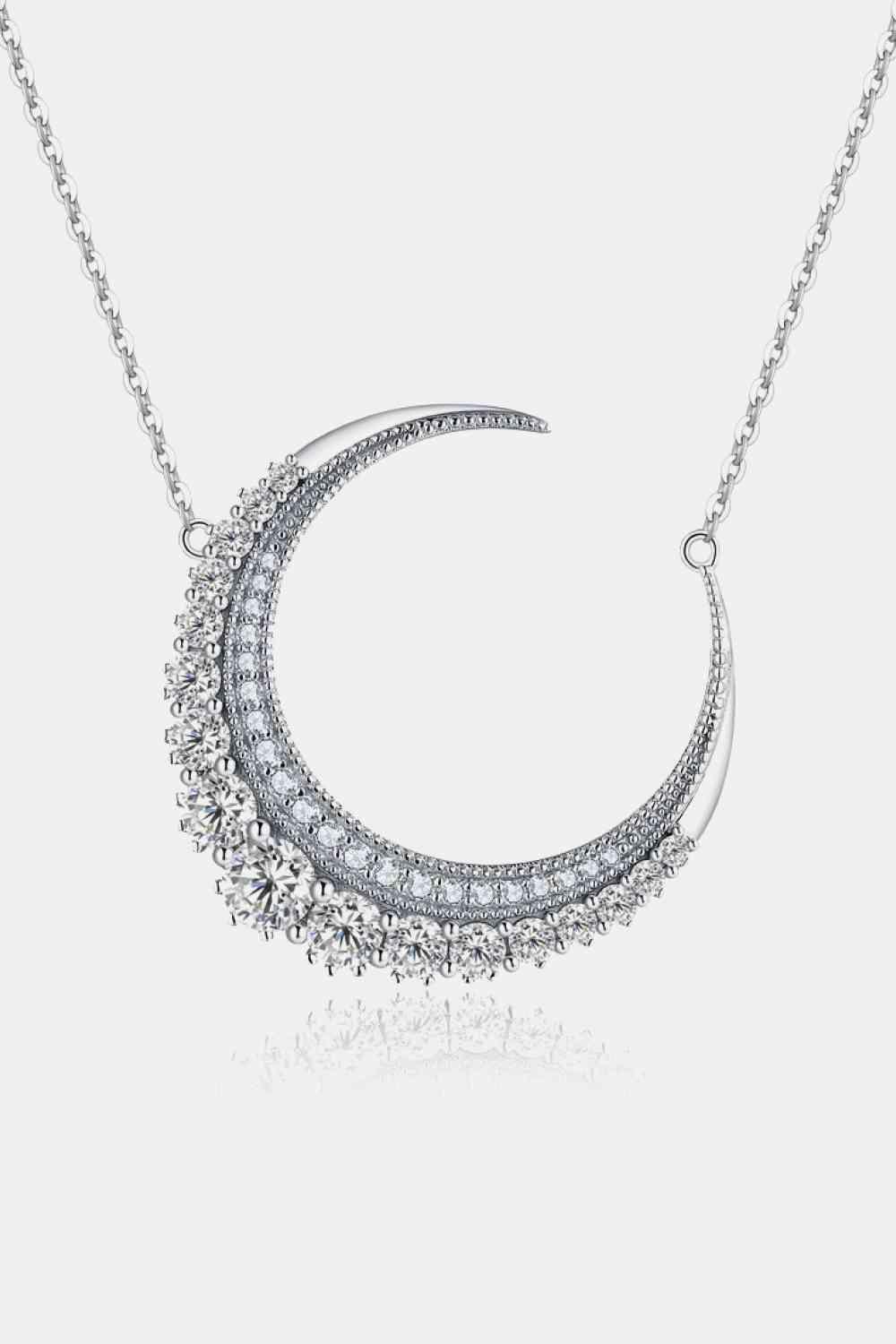 a necklace with a crescent design on it
