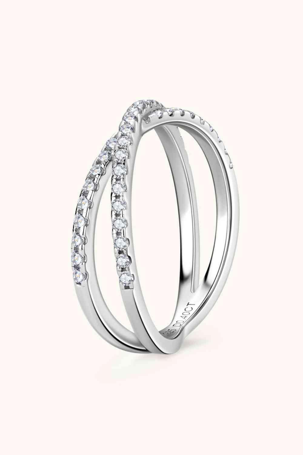 a white gold ring with three rows of diamonds