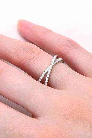 a woman's hand with a diamond ring on it