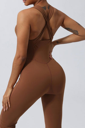 a woman in a brown bodysuit with a tattoo on her back