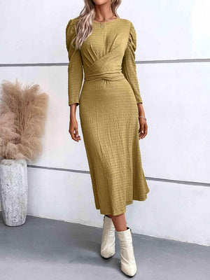 a woman wearing a mustard colored dress