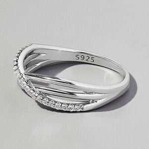 a white gold ring with three rows of diamonds