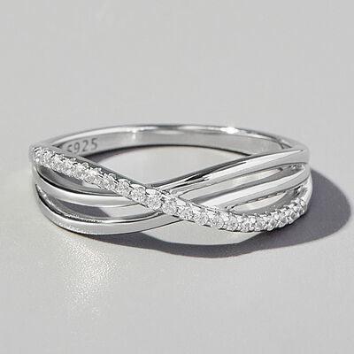 a white gold ring with diamonds on a white background