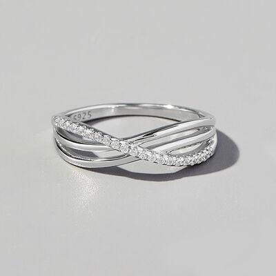 a white gold ring with diamonds on a white background