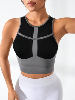 a woman wearing a black and grey sports bra