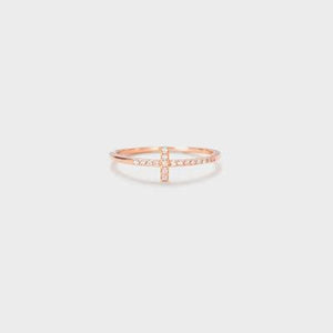 a rose gold ring with a diamond cross