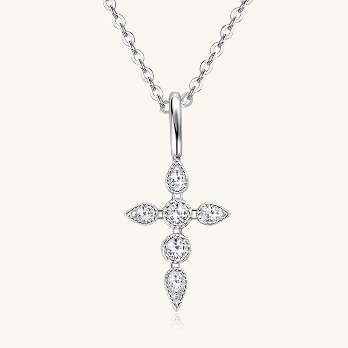 a diamond cross pendant on a chain