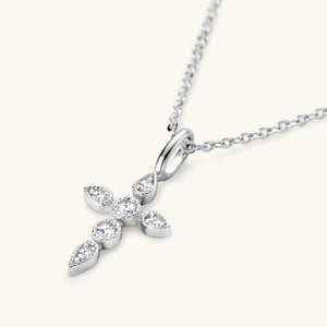 a diamond cross pendant on a chain