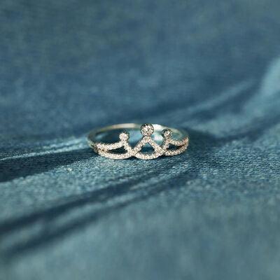 a close up of a ring on a blue cloth