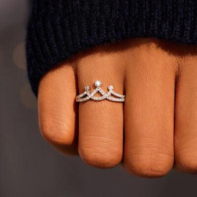 a close up of a person's hand with a ring on it