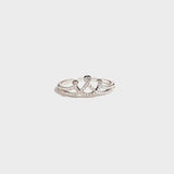 a white gold ring with diamonds on a white background