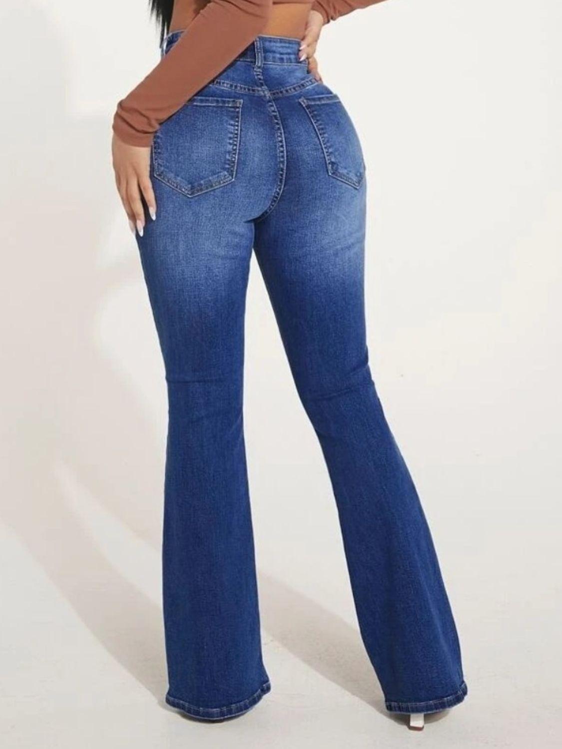 a woman in a brown top and blue jeans