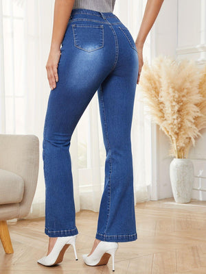 a woman wearing high rise jeans and heels