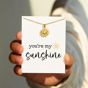 a person holding a card that says you're my sunshine