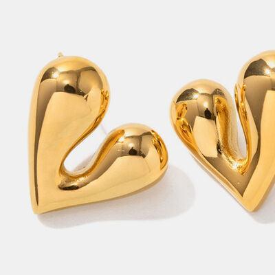 a pair of gold heart shaped earrings on a white background